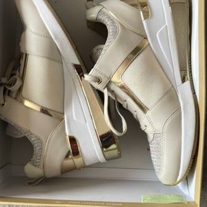 Michael Kor cream and gold shoes.